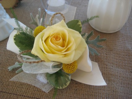 yellow corsage with burlap accents