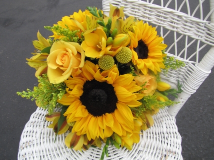 sunflowers, freesia, roses, billy balls, alstromeria and solid aster